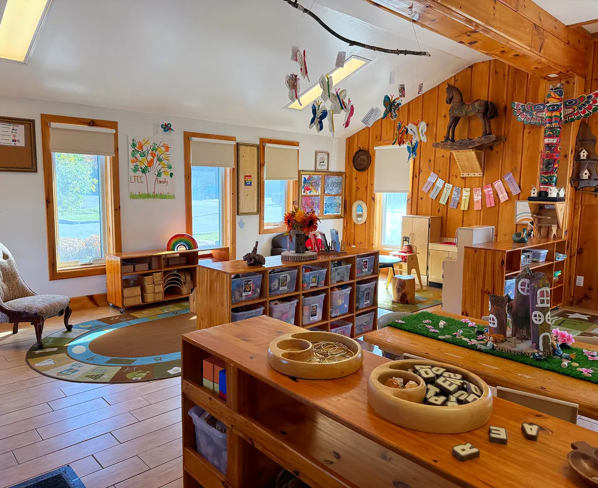 Learning Together Childcare classroom with natural wood interiors and multiple play-based learning areas