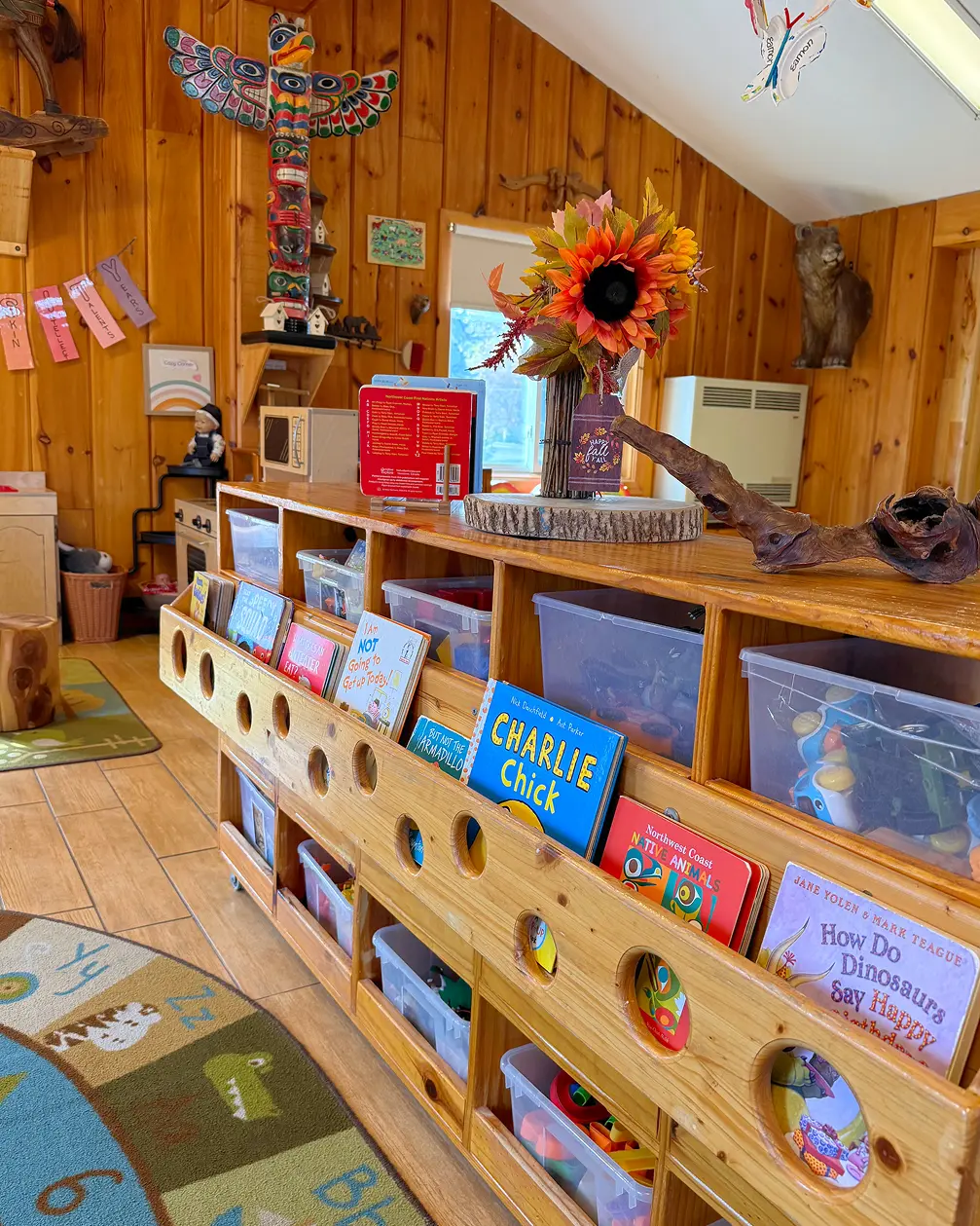 Learning Together Childcare classroom with natural wood interiors and multiple play-based learning areas