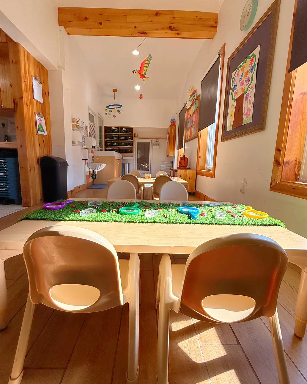 Learning Together Childcare classroom with natural wood interiors and multiple play-based learning areas
