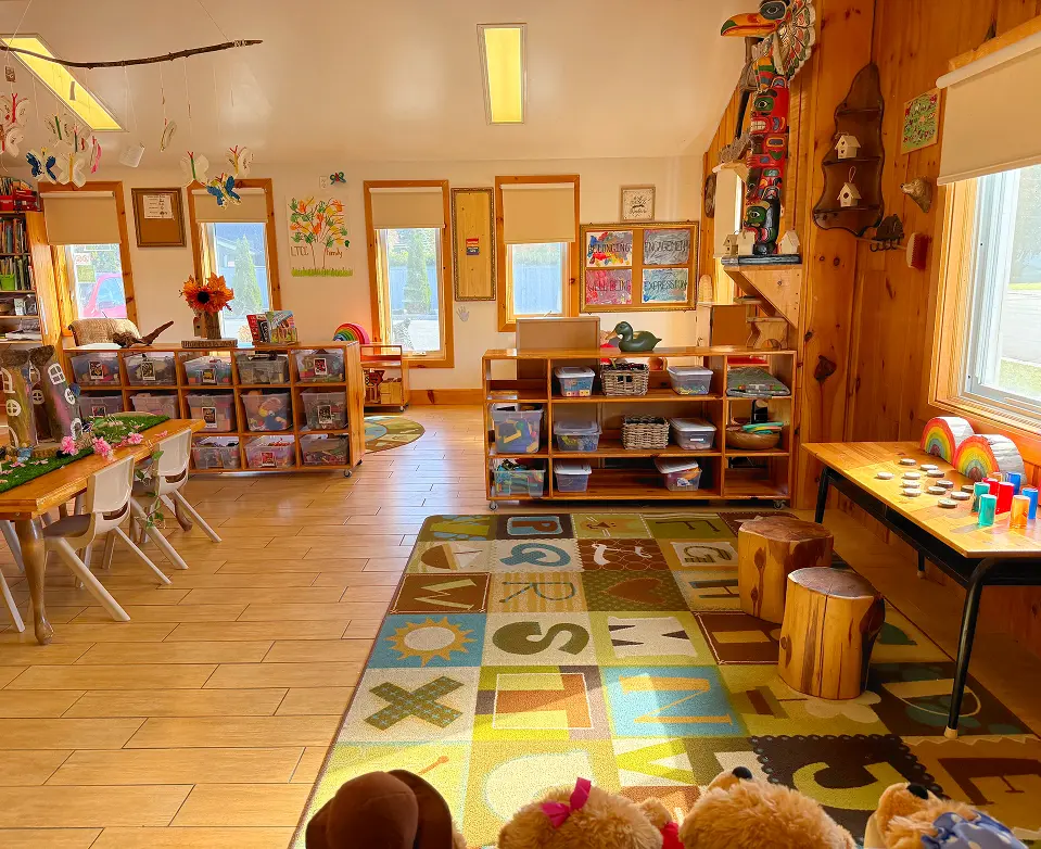 Learning Together Childcare classroom with natural wood interiors and multiple play-based learning areas