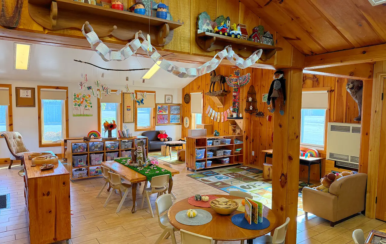 Learning Together Childcare classroom with natural wood interiors and multiple play-based learning areas