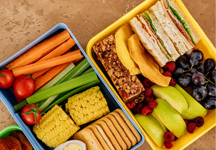 Healthy children's lunches with sandwiches, fruit, vegetables and crackers