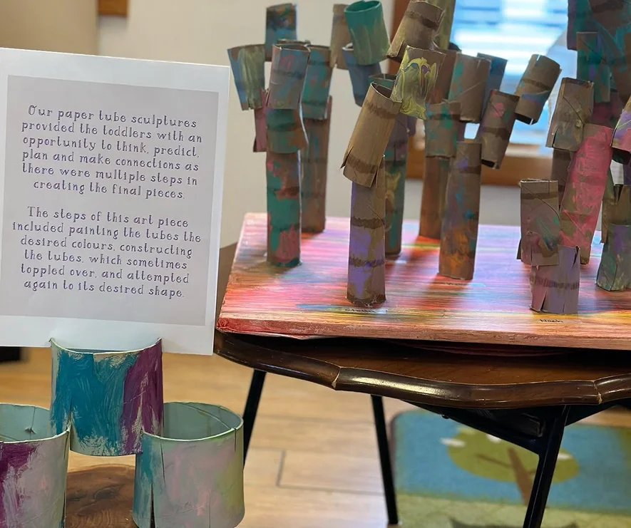 Children’s painted paper tube sculptures displayed at Learning Together Childcare