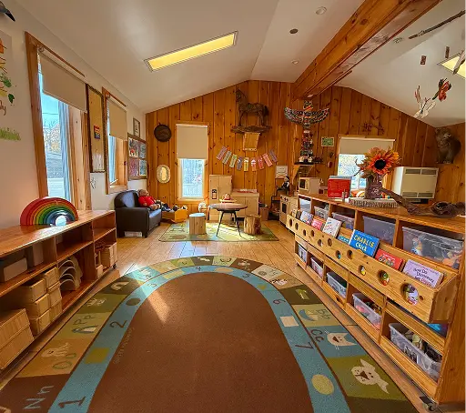 Learning Together Childcare classroom with natural wood interiors and multiple play-based learning areas